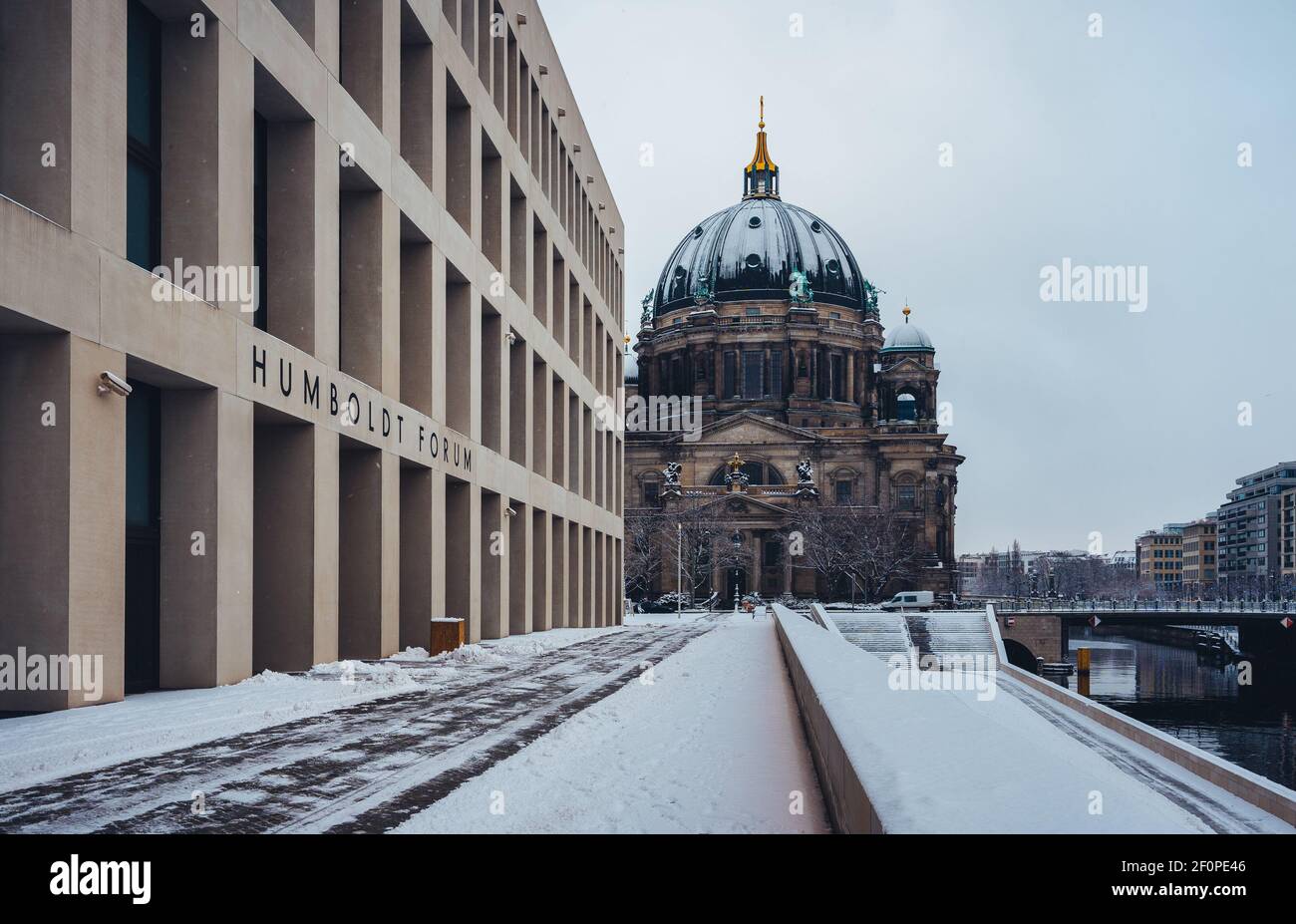 Berlin, Germany - February 06, 2021: View towards Humboldt Forum and Berlin Cathedral covered in snow during blizzard. Stock Photo