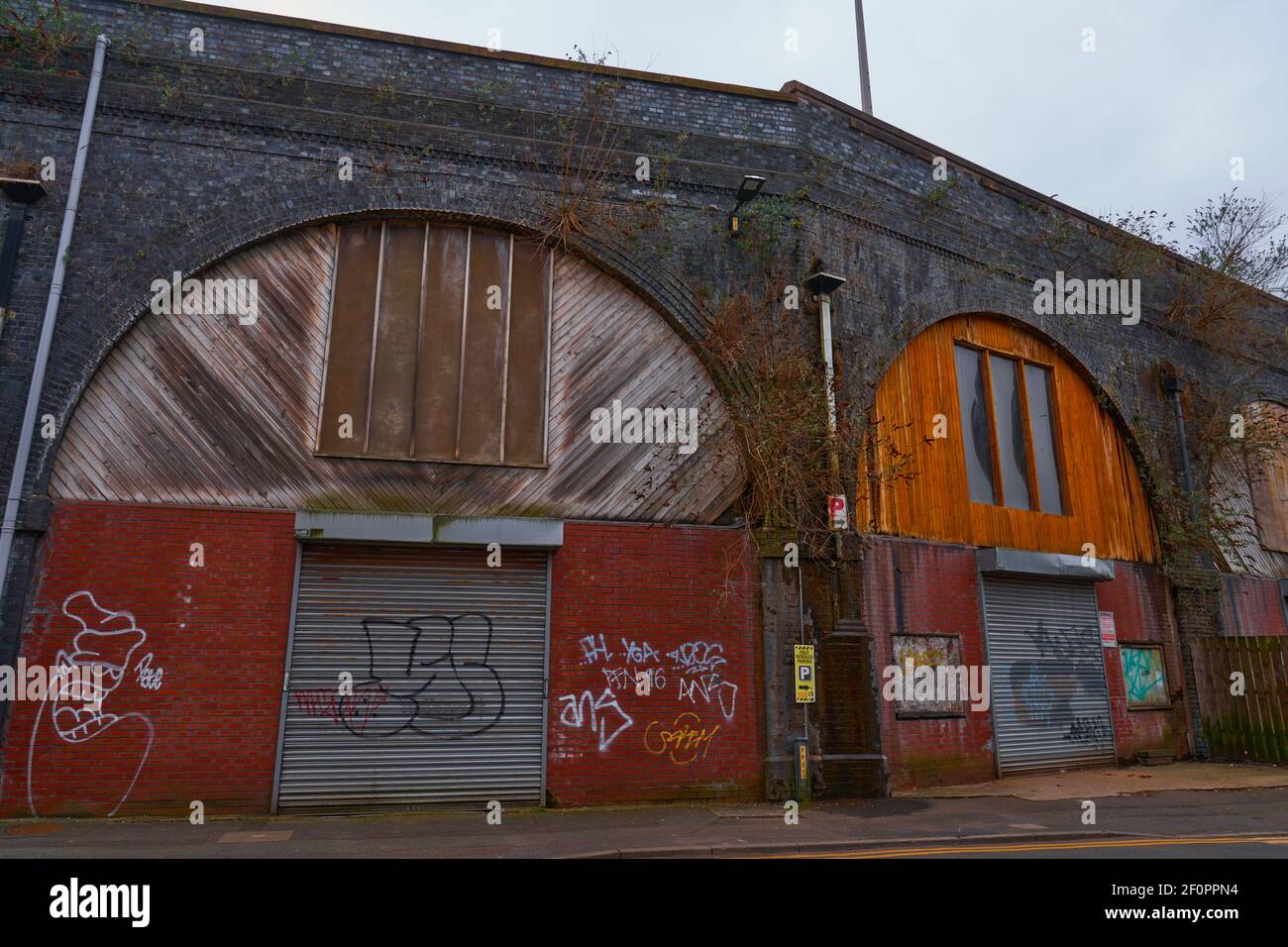 Industrial workshops under the arches Stock Photo