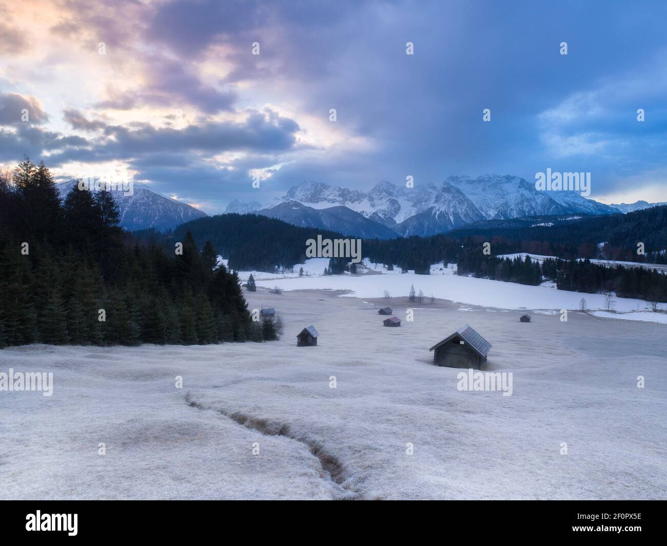 Frosty pinkish sunrise at Lake Gerold in the Karwendel Mountains Stock Photo