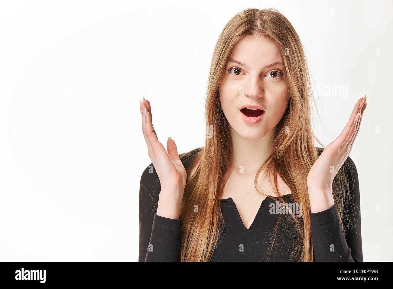 A beautiful young surprised woman. Isolated over white Stock Photo - Alamy