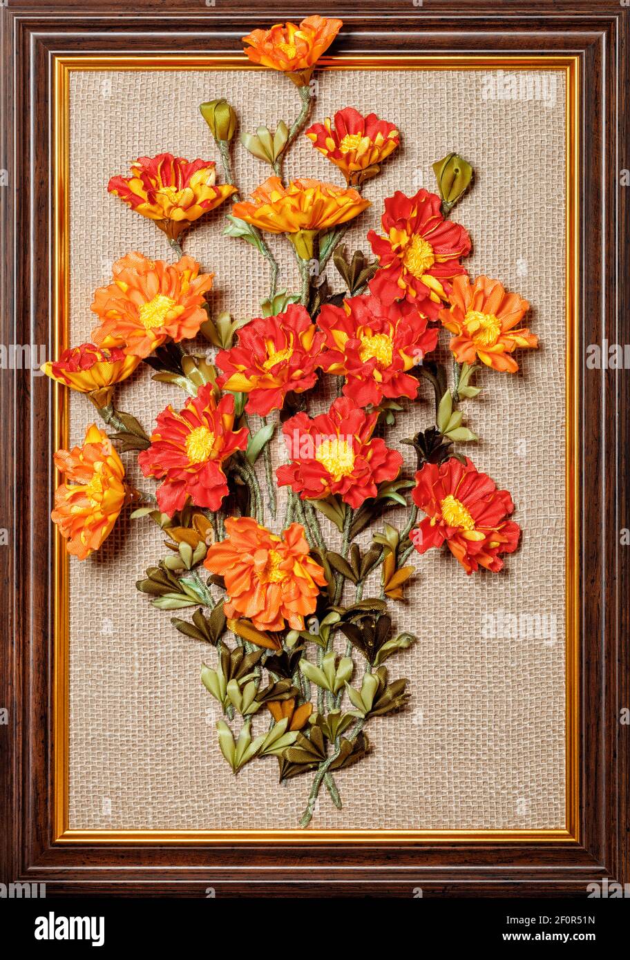 Beautiful and colorful artificial bouquet of Marigolds flowers, framed