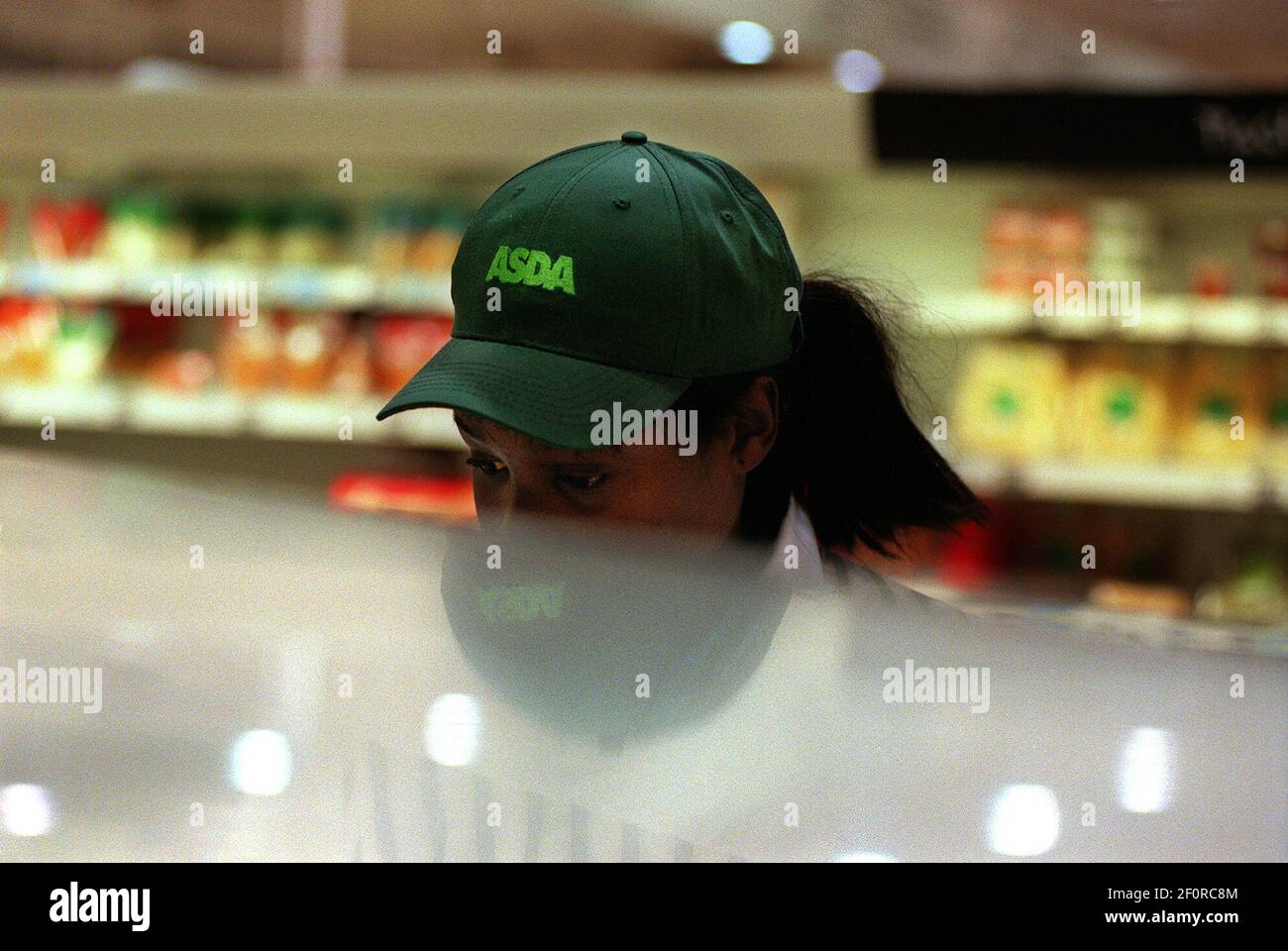 ASDA Supermarket Clapham London January 2001Woman worker shelf stacker