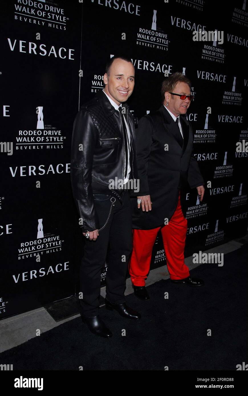 Elton John (R) and his partner David Furnish. 8 February 2007 - Beverly  Hills, California. Gianni And Donatella Versace Receive Rodeo Drive Walk Of  Style Award at the Beverly Hills City Hall.