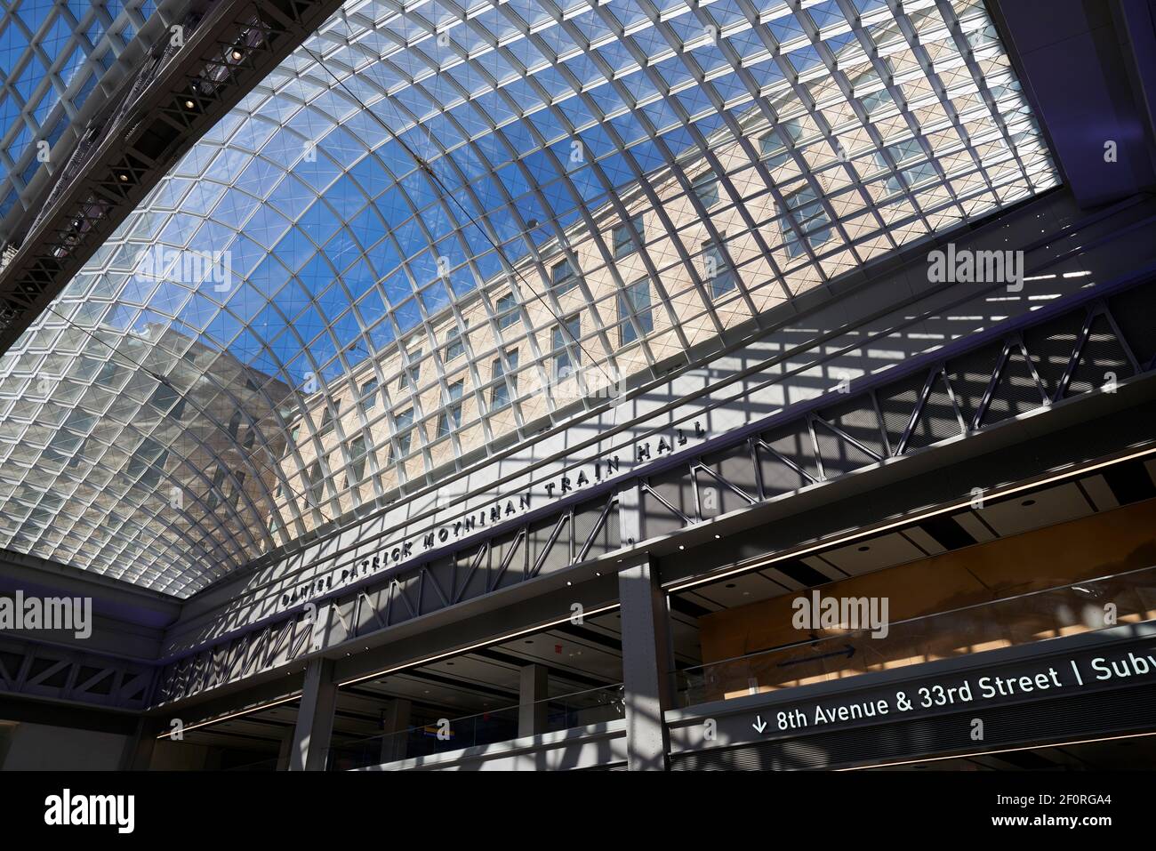 Glass roof over the interior of the Moynihan train hall at Penn Station in New York City. Stock Photo
