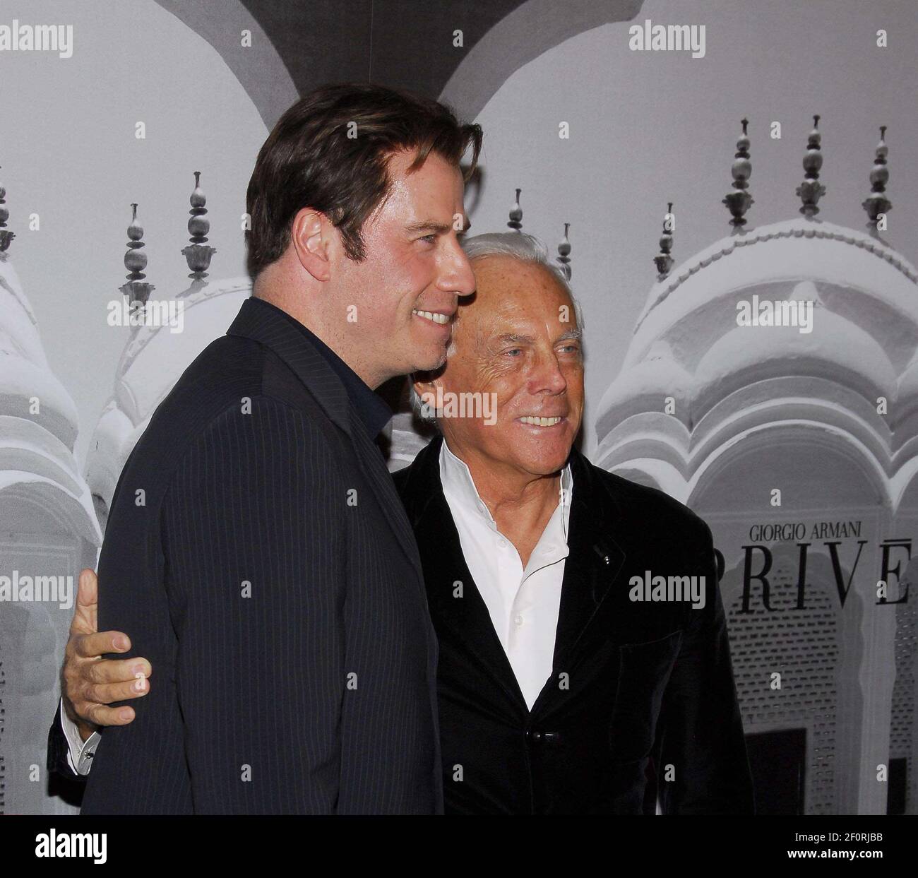 John Travolta and Giorgio Armani. 24 February 2007 - Beverly Hills,  California. Giorgio Armani Celebrates The Oscars with Exclusive Prive Show  held at the Green Acres Estates. Photo Credit: Giulio Marcocchi/Sipa Press  (')