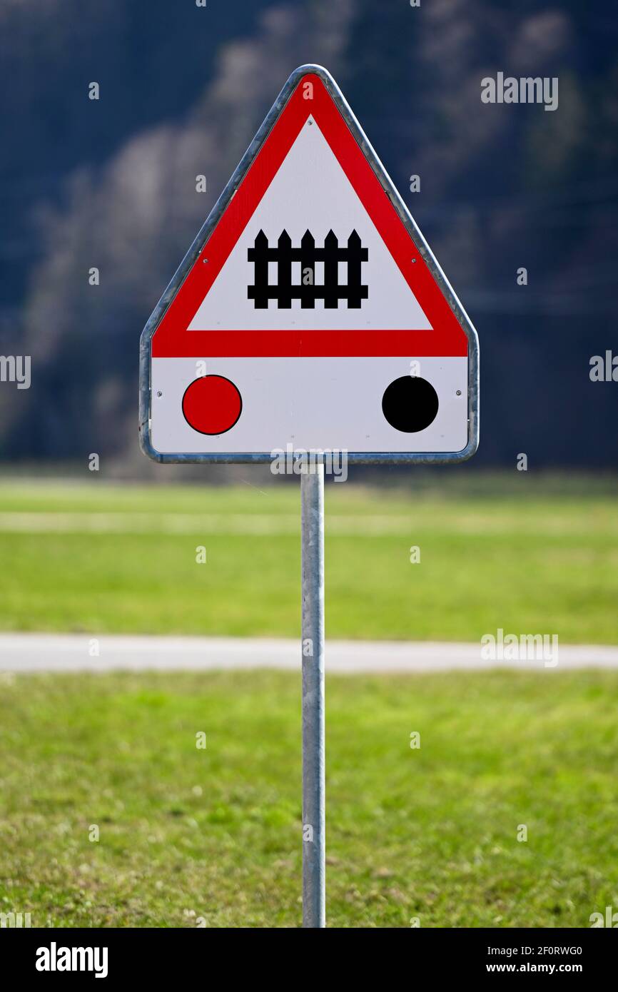 Traffic sign level crossing with barriers and traffic lights, Meiringen, Switzerland Stock Photo