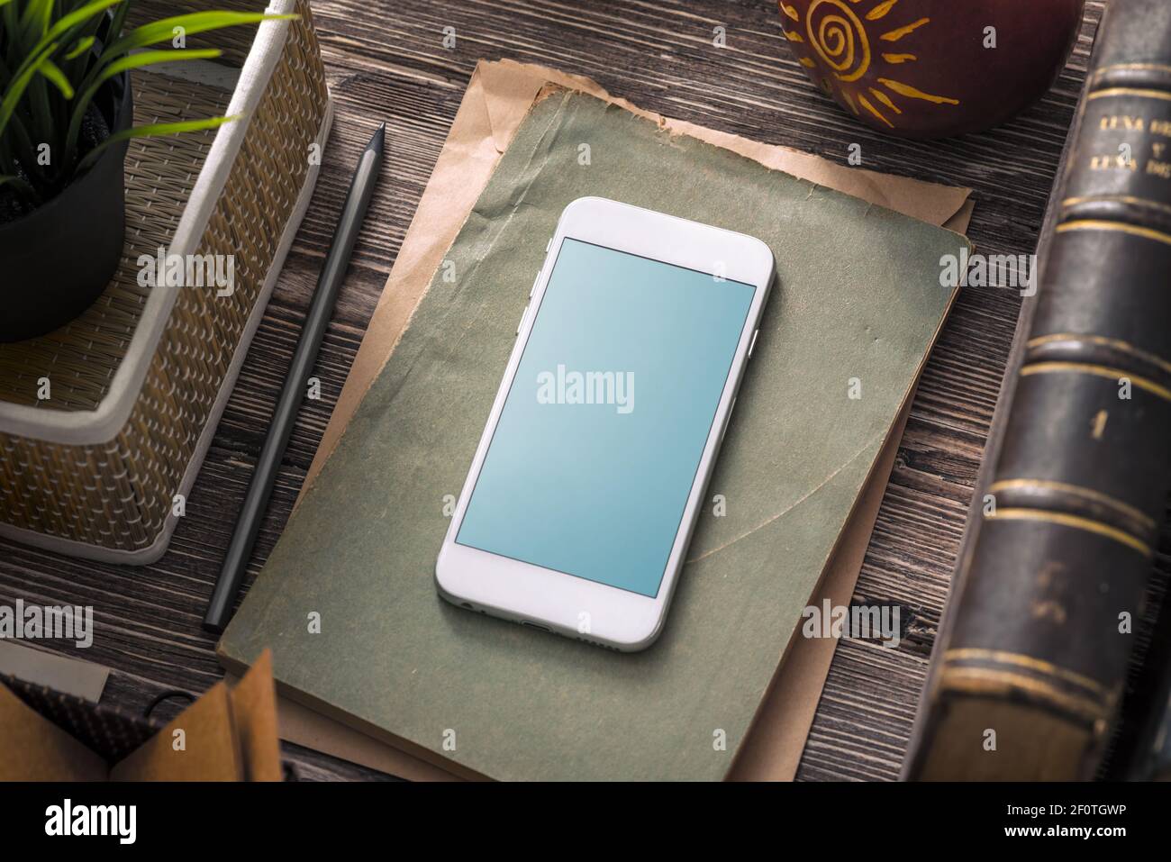 Mockup of white smartphone on the table. Clipping path Stock Photo