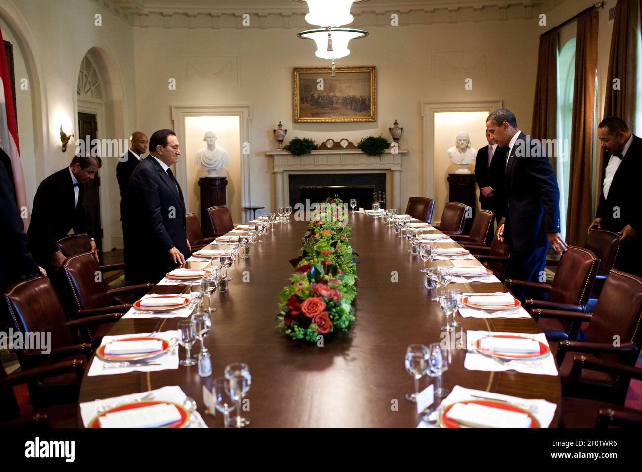President Barack Obama and  Egyptian President Hosni Mubarak approach the table at the start of a working lunch in the Cabinet Room of the White House Aug. 18 2009. Stock Photo