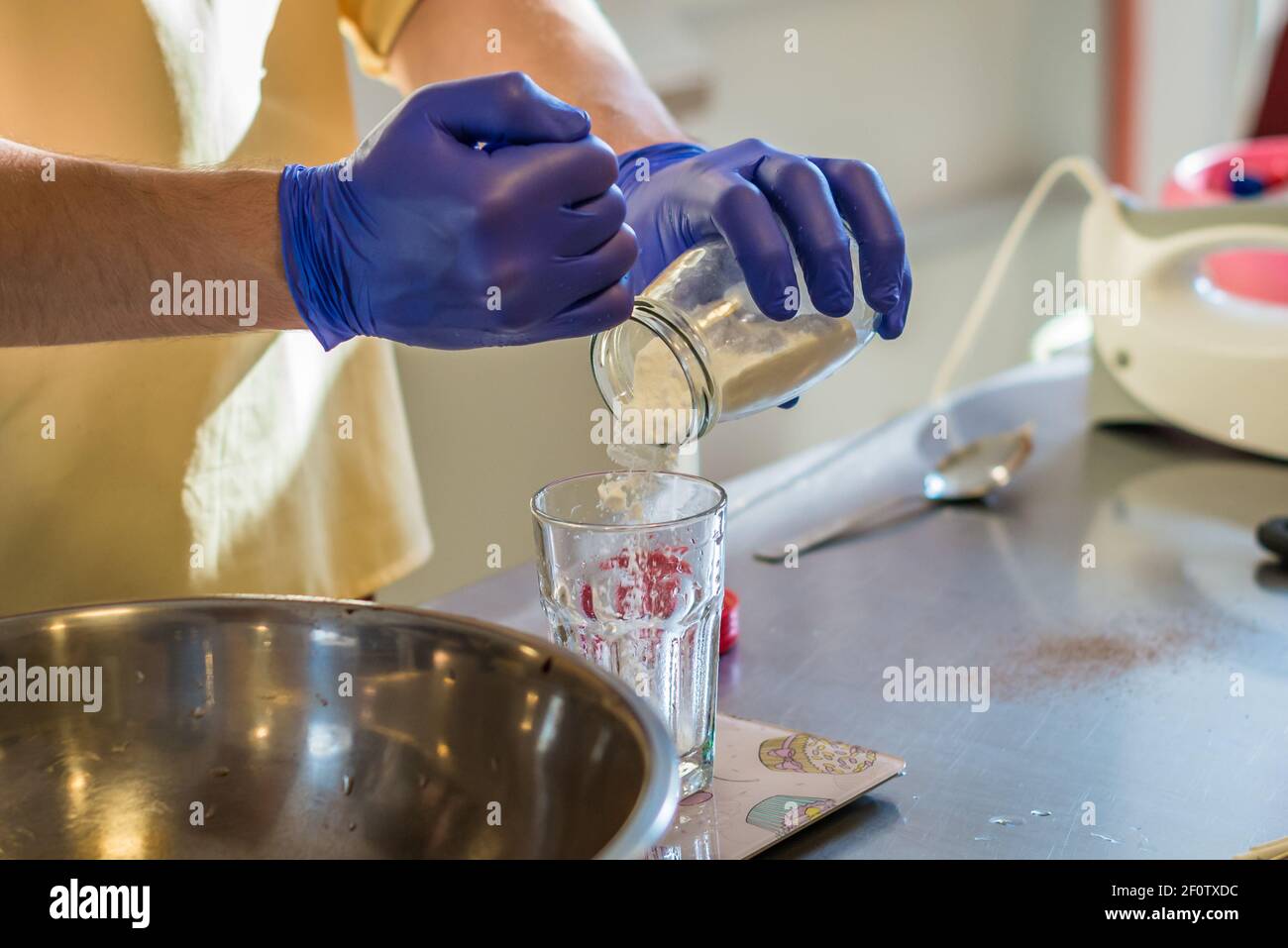 Hand pouring soda into a glass Stock Photo Alamy