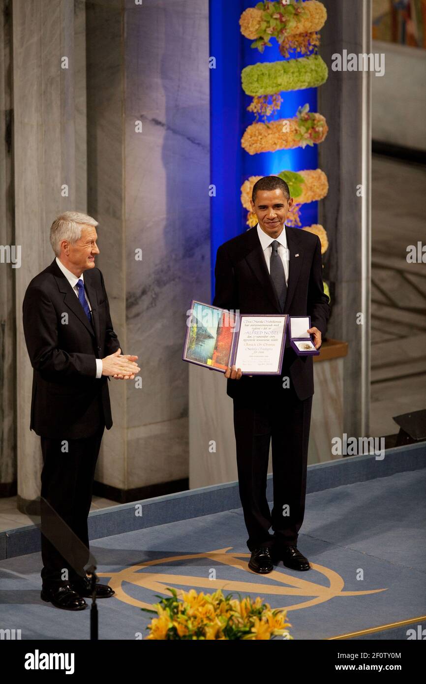 Nobel Committee Chairman Thorbjorn Jagland presents President Barack Obama with the Nobel Prize medal and diploma during the Nobel Peace Prize ceremony in Raadhuset Main Hall at Oslo City Hall in Oslo Norway Dec. 10 2009. Stock Photo