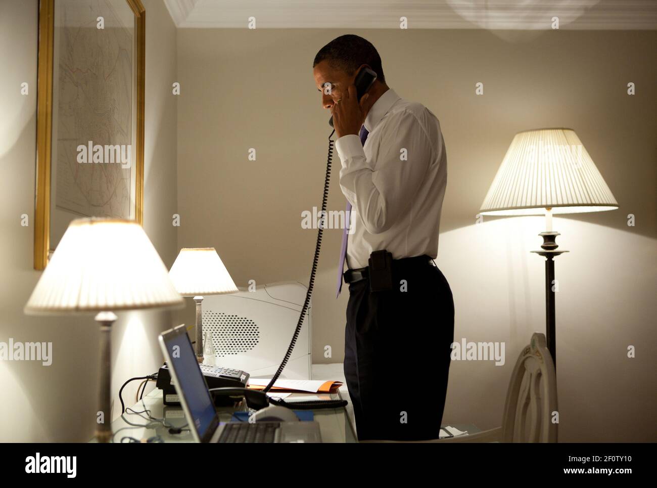President Barack Obama talks on the phone with Missouri Governor Jay Nixon during his visit to Dublin Ireland May 23 2011. The President extended his condolences to all impacted by the deadly tornadoes in Joplin Mo. Sunday night. Stock Photo