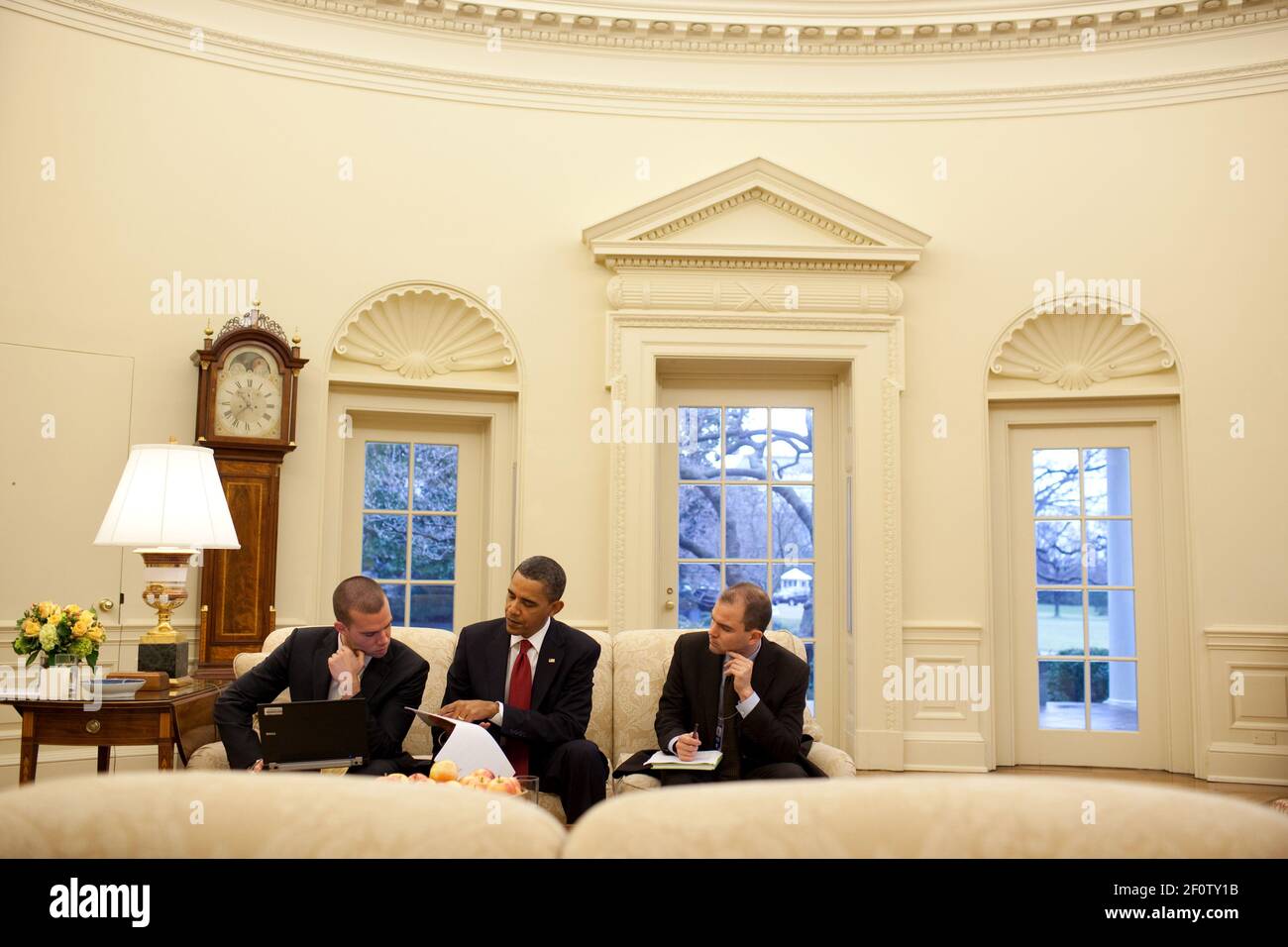 President Barack Obama prepares for his State of the Union speech with Director of Speechwriting Jon Favreau and Ben Rhodes Deputy National Security Advisor for Strategic Communications in the Oval Office Jan. 25 2010. Stock Photo