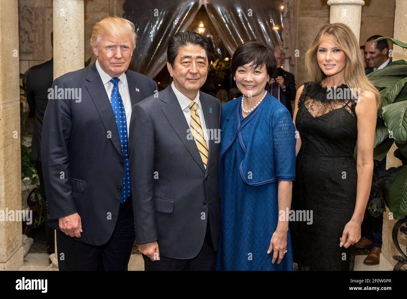 President Donald Trump and First Lady Melania Trump are joined by Japanese Prime Minister ShinzÅ Abe and his wife Mrs. Akie Abe as they pose for photos Saturday Feb. 11 2017 at Mar-a-Lago in Palm Beach FL. Stock Photo