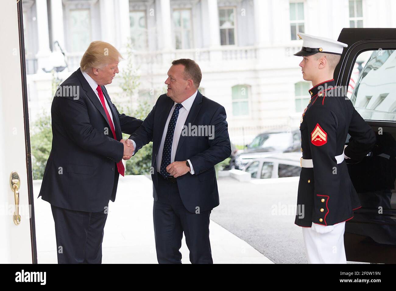 President Donald Trump greets Danish Prime Minister Lars LÃ¸kke Rasmussen in the West Wing entrance of the White House Thursday March 30 2017. Stock Photo