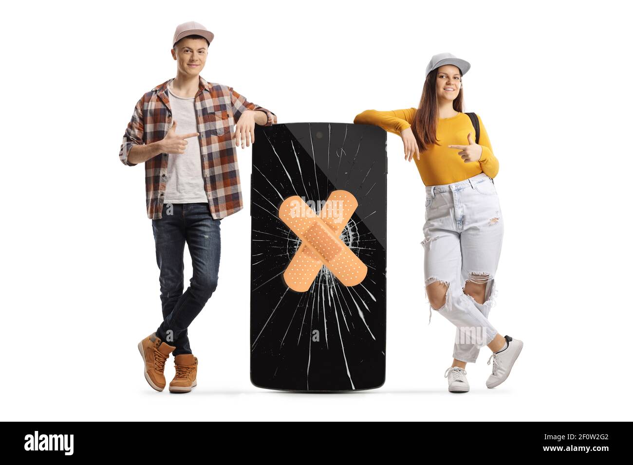 Young male and female students leaning on a phone with a broken screen and pointing at the crack isolated on white background Stock Photo