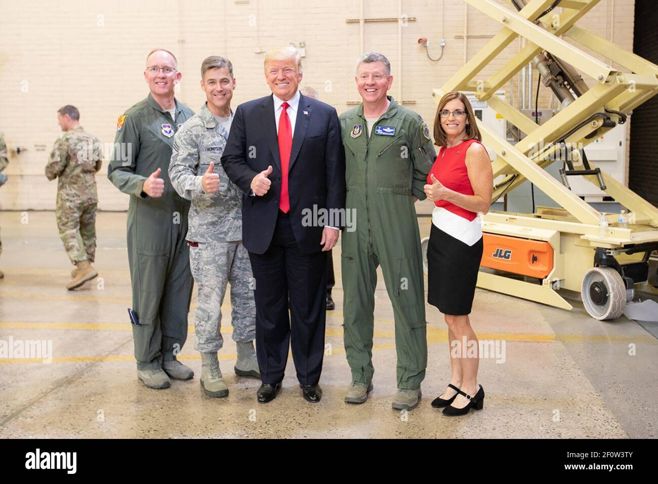 President Donald Trump poses for a photo with Brig. Gen. Todd Canterbury Chief Master Sgt. Ronald Thompson Col. Bryan Cook and U.S. Rep. Martha McSally R-Ariz. after participating in a defense capability tour Friday Oct. 19 2018 at Luke Air Force Base Ariz. Stock Photo