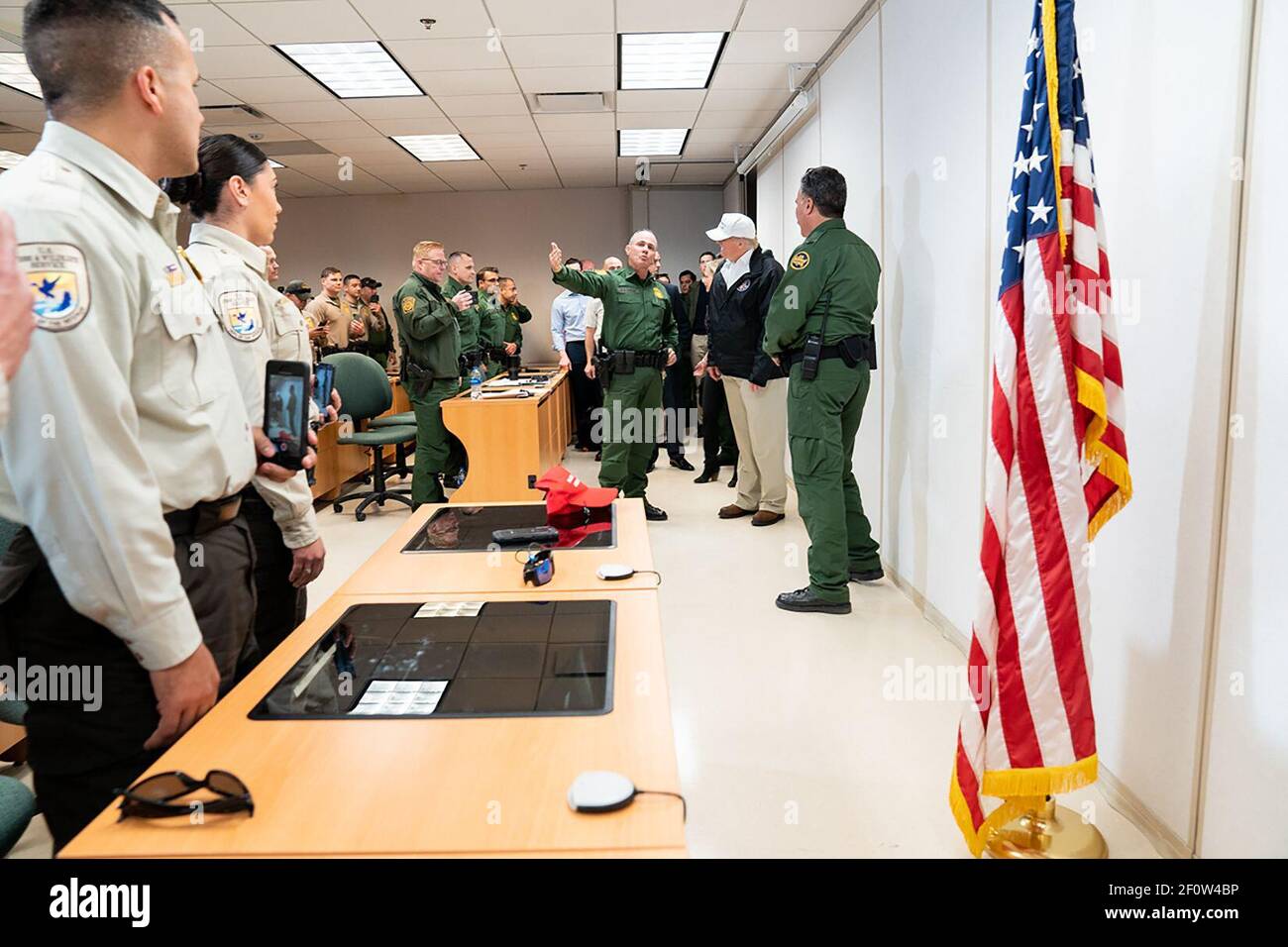 President Donald Trump speaks with U.S. Customs and Border Protection officers coming in for their shift change after President Trump attended a Roundtable on Immigration and Border Security Thursday January 10 2019 at the U.S. Border Patrol McAllen Station in McAllen Texas. Stock Photo