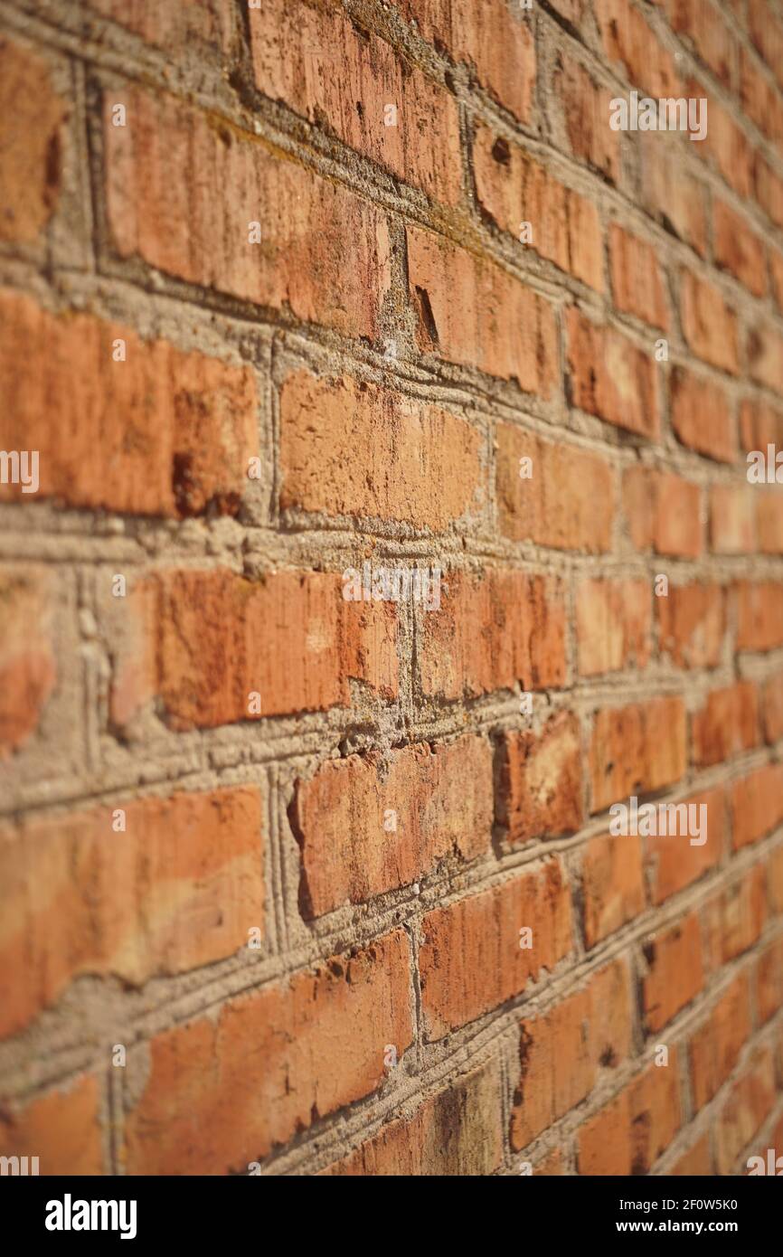 Old red brick wall background. Perspective view. Stock Photo