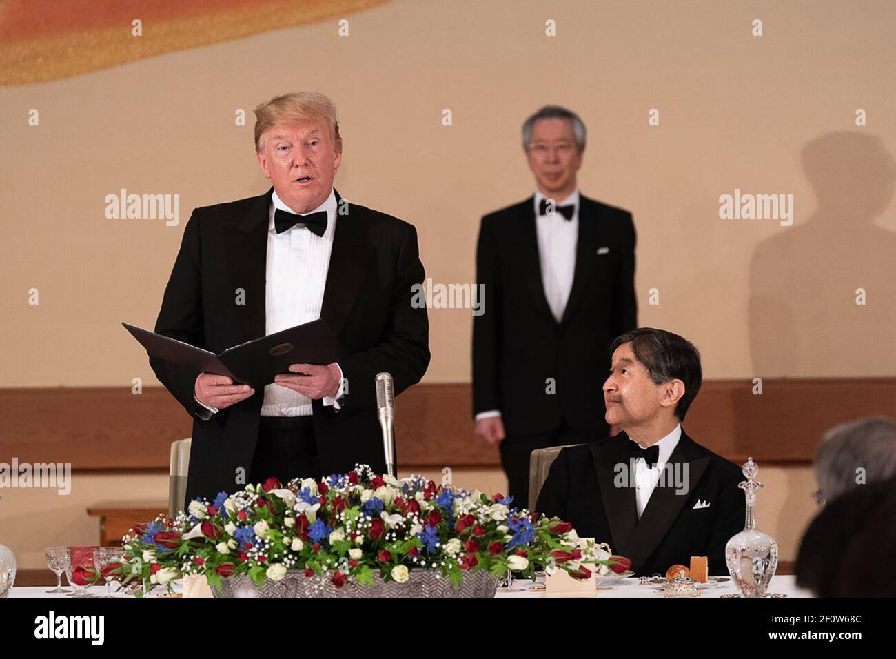 President Donald Trump delivers remarks as Emperor Naruhito of Japan listens during the state banquet at the Imperial Palace Monday May 27 2019 in Tokyo. Stock Photo