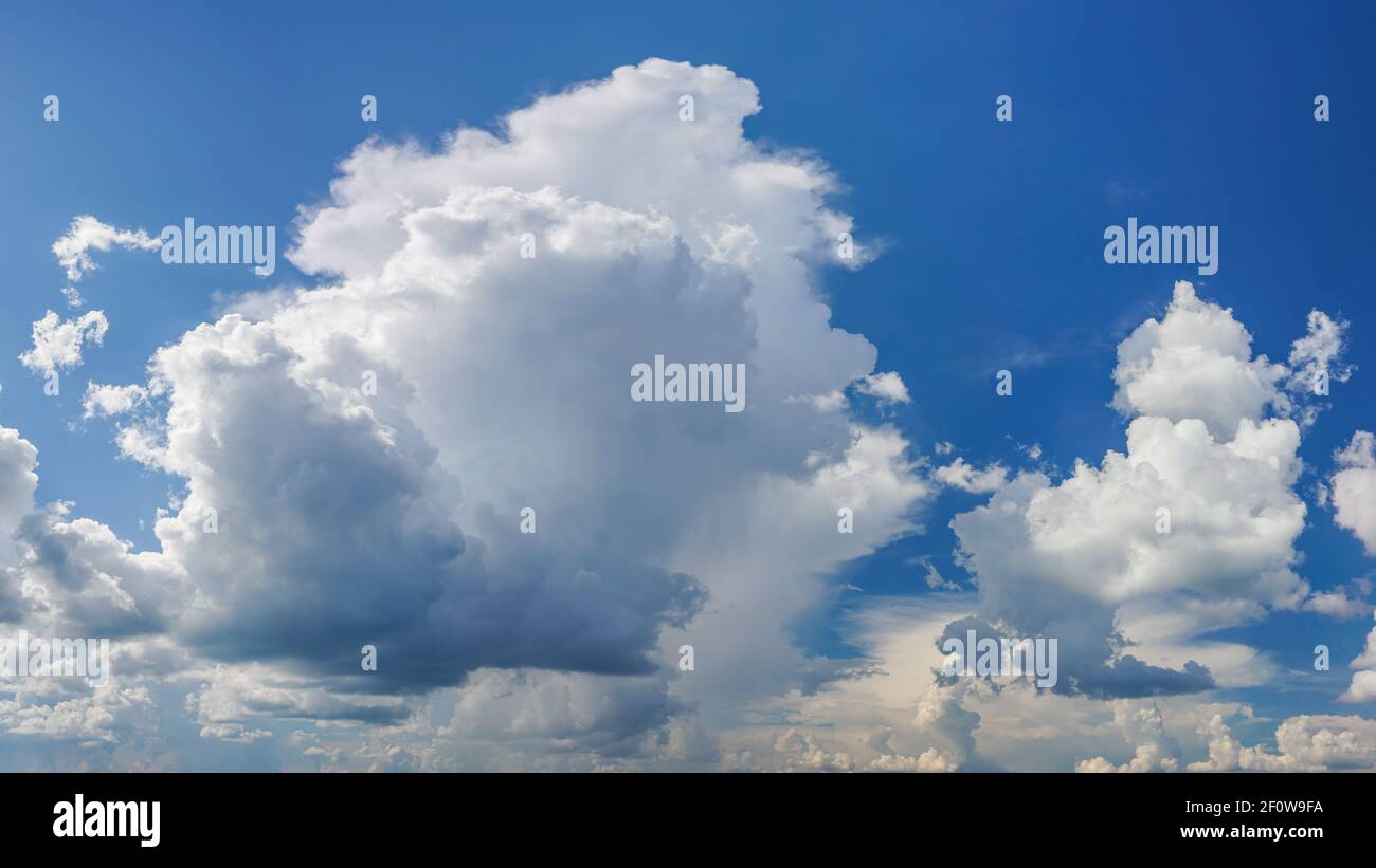 Dramatic white clouds on blue sky Stock Photo