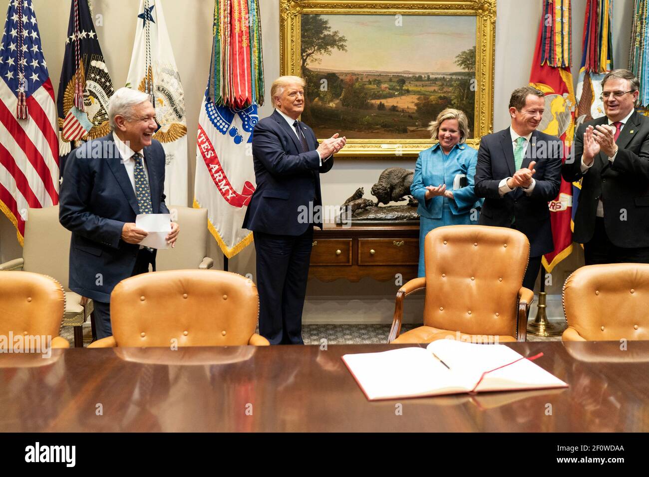 President Donald Trump applauds the President of the United Mexican States Andres Manuel Lopez Obrador and members of his delegation Wednesday July 8 2020 in the Roosevelt Room of the White House. Stock Photo