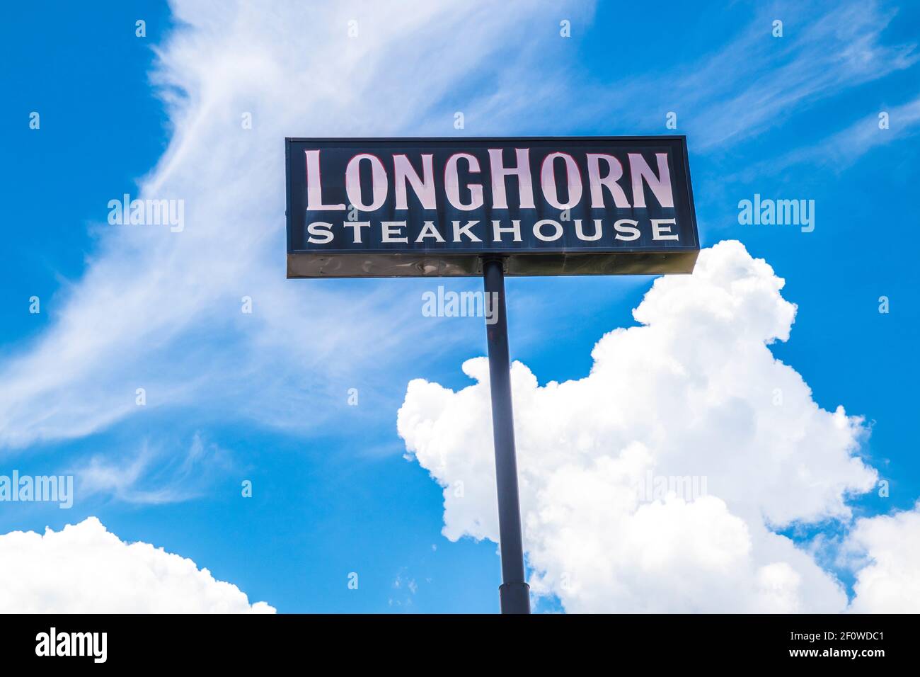 Conyers, Ga / USA 07 27 20 LongHorn Steakhouse sky sign with a blue