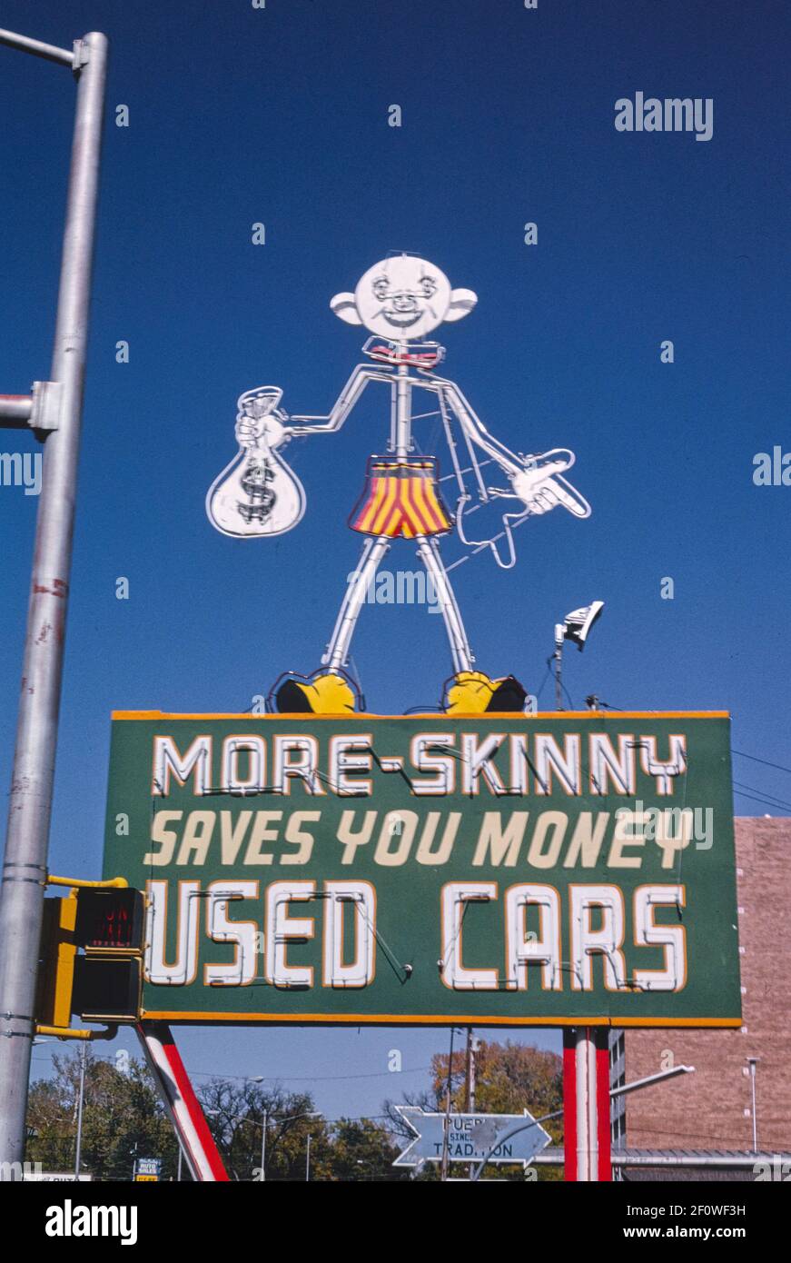 More Skinny Used Car sign Santa Fe Avenue Pueblo Colorado ca. 1991 Stock Photo