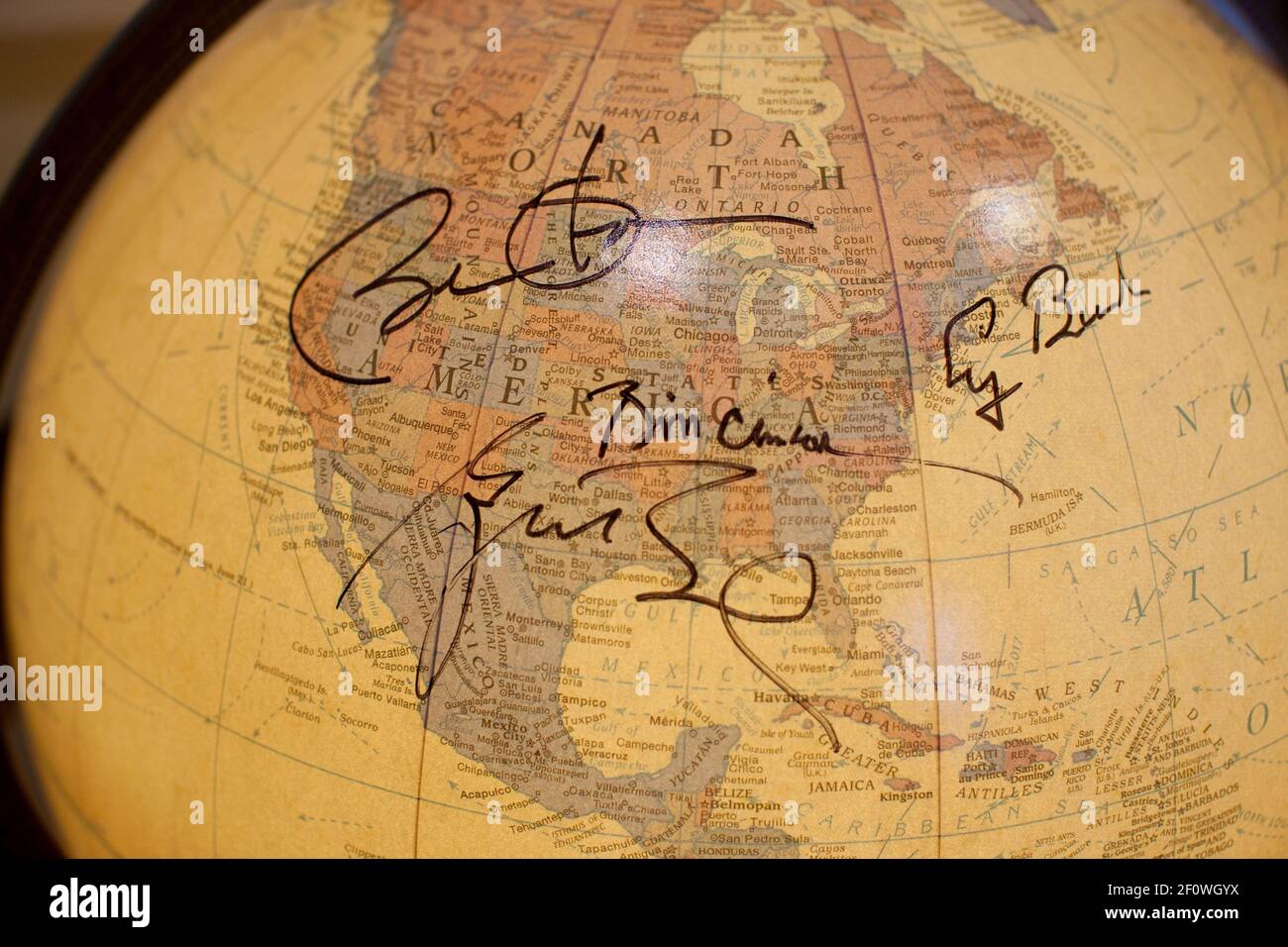 The signatures of President Barack Obama and former Presidents George W. Bush, Bill Clinton and George H.W. Bush adorn a globe in the Doctors Office of the White House, Sept. 16, 2010. Stock Photo