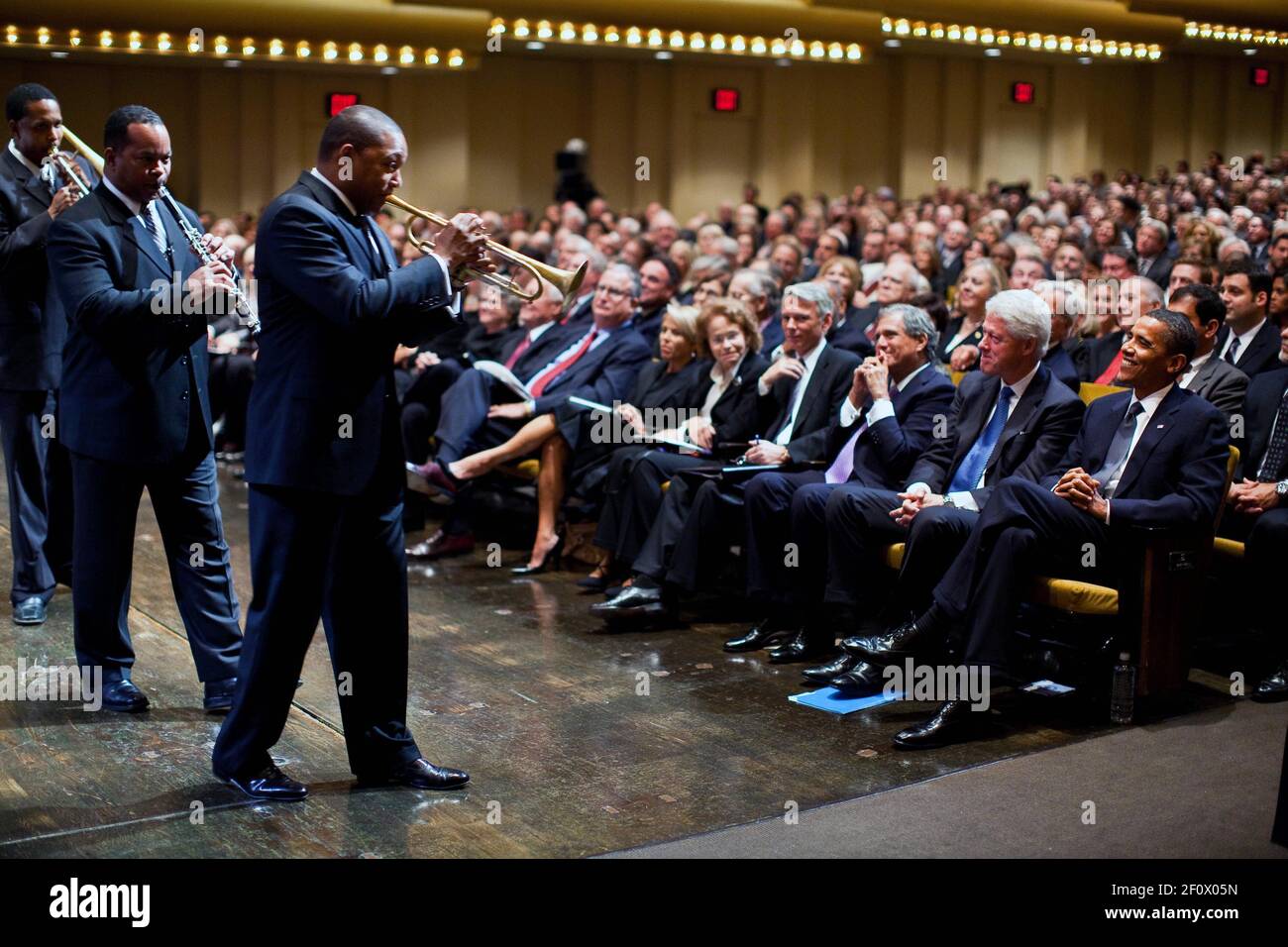 President Barack Obama and former President Bill Clinton look on as jazz musician Wynton Marsalis and band perform at the memorial service for Walter Cronkite at Lincoln Center in New York, New York,  Sept. 9, 2009 Stock Photo