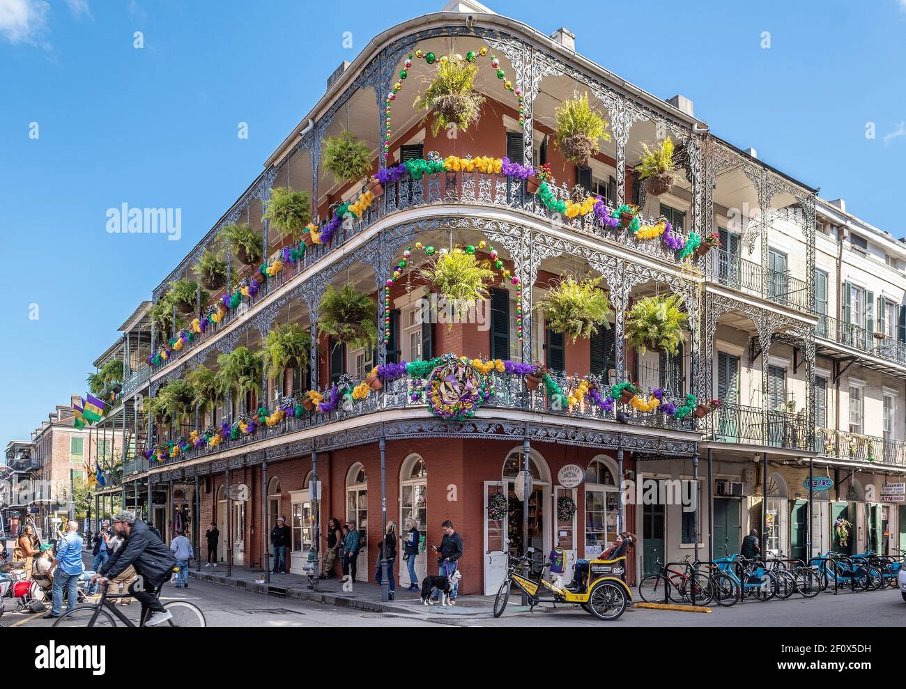 New Orleans Mardi Gras decorations on balconies in the French Quarter, corner of Royal Street and St Peter. Stock Photo