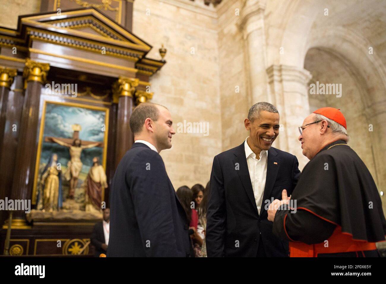 President Barack Obama and Ben Rhodes talk with Cardinal Jamie Ortega while touring La Catedral de la Virgen Maria de la Concepcion Inmaculada with Cardinal Jamie Ortega in Old Havana, Cuba, Sunday, March 20, 2016. Stock Photo