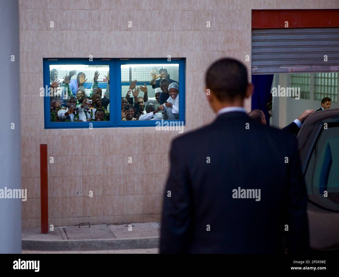 Wave Frantically President Obama walking to his limousine in Ghana and a group of hotel ...