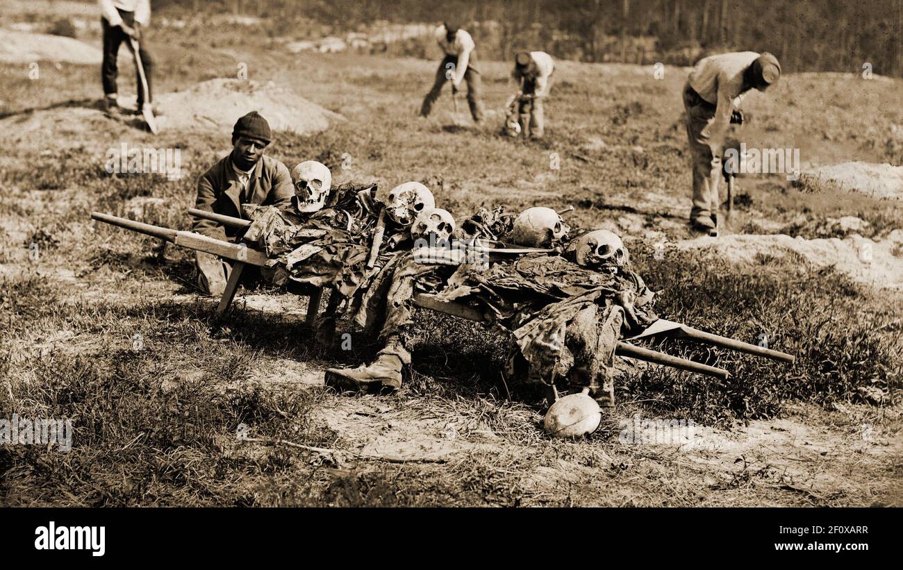 African Americans collecting bones of soldiers killed in the  battle Grant's Wilderness Campaign, Cold Harbor, Va. May-June 1864. Stock Photo