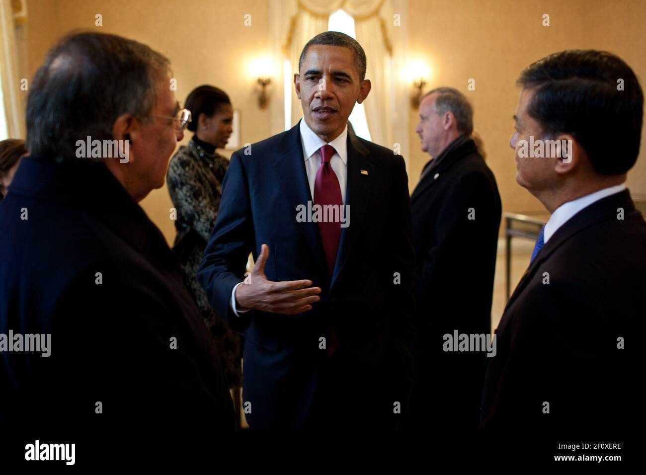 President Barack Obama talks with Defense Secretary Leon Panetta, left, and Veterans Affairs Secretary Eric Shinseki, right, Nov. 11, 2011 Stock Photo