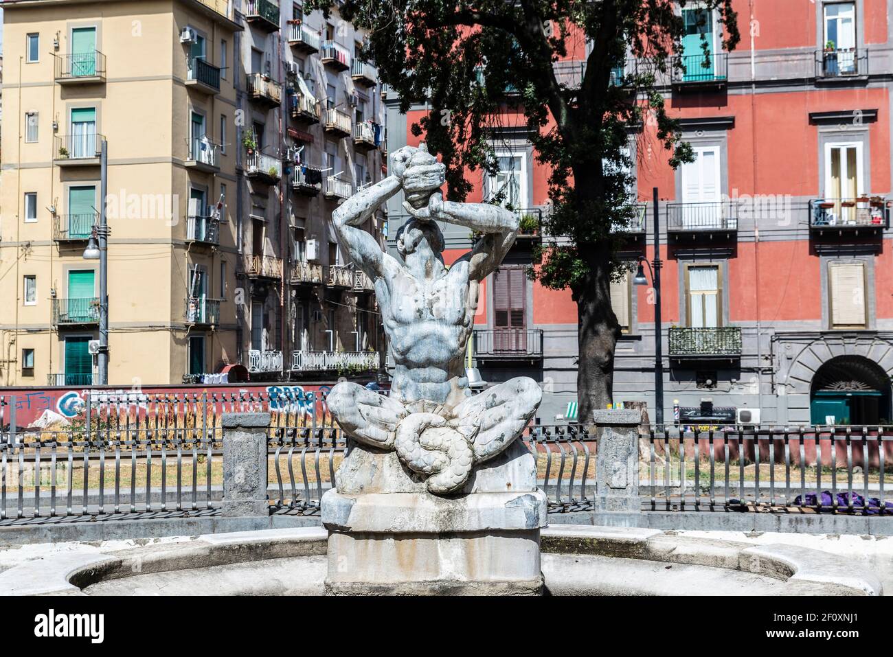 Naples, Italy - September 9, 2019: Fontana del Tritone in Piazza Cavour, ornamental fountain in the historical center of Naples, Italy Stock Photo