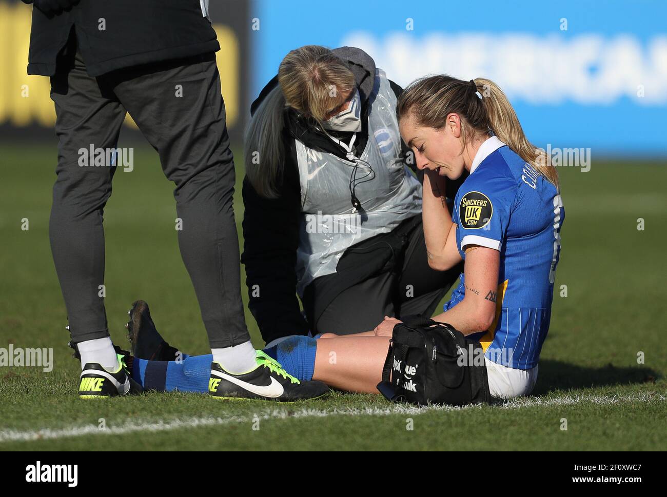Crawley, UK. 7th March 2021. Megan Connolly of Brighton Receives medical attention during the FA Women's Super League match between Brighton & Hove Albion Women and Tottenham Hotspur Women at The People's Pension Stadium on March 7th 2021 in Crawley, United Kingdom Stock Photo