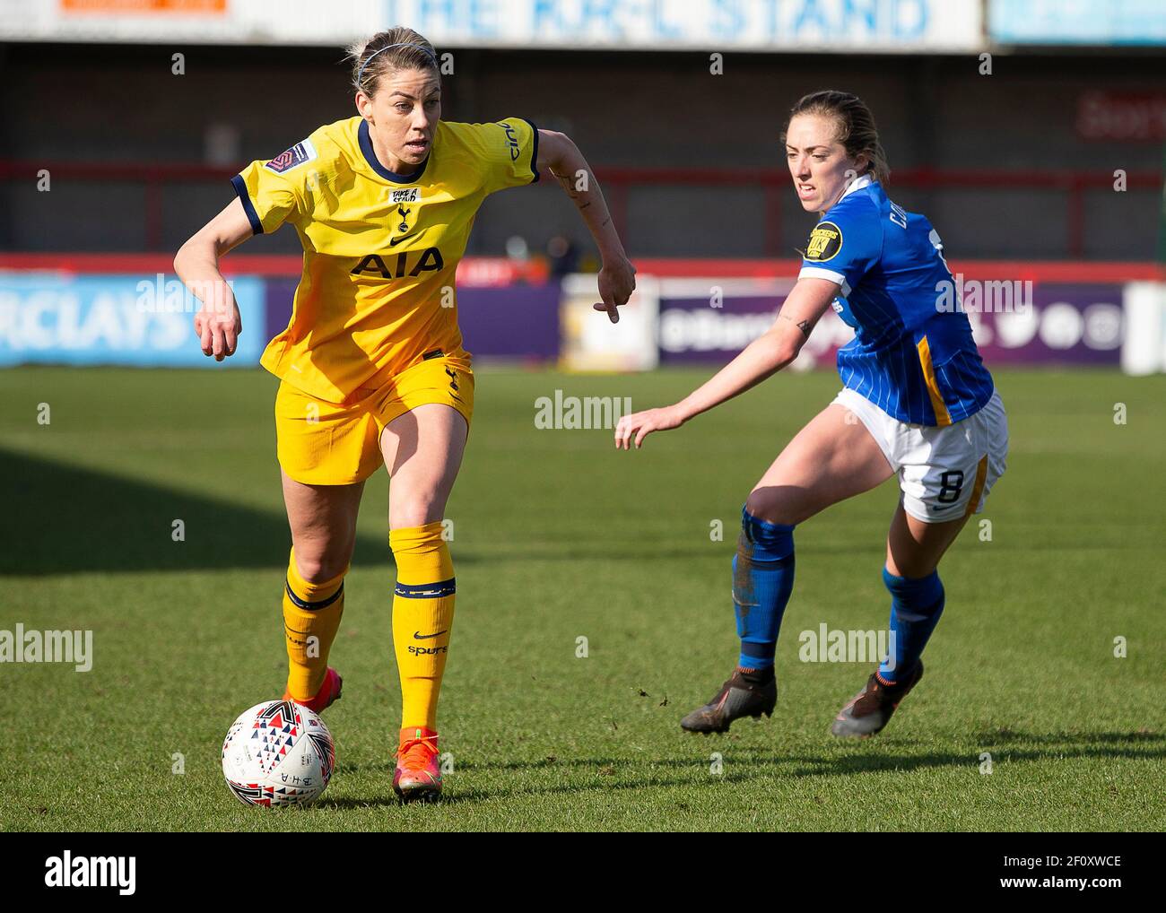Crawley, UK. 7th March 2021. Alanna Kennedy of Tottenham with the ball ahead of Megan Connolly of Brighton during the FA Women's Super League match between Brighton & Hove Albion Women and Tottenham Hotspur Women at The People's Pension Stadium on March 7th 2021 in Crawley, United Kingdom Stock Photo