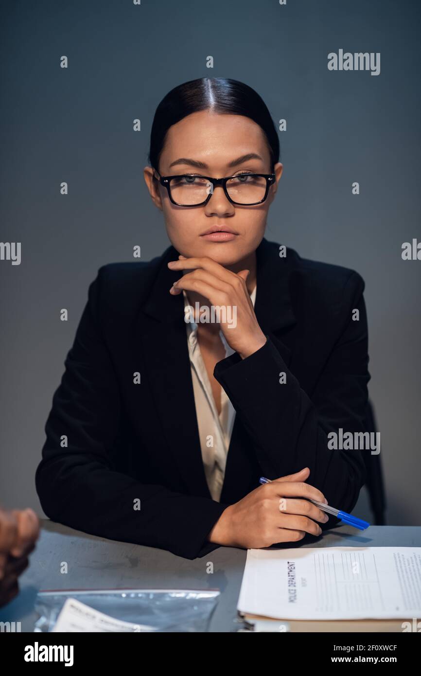 Cute strict lawyer girl with glasses posing for a photo in the