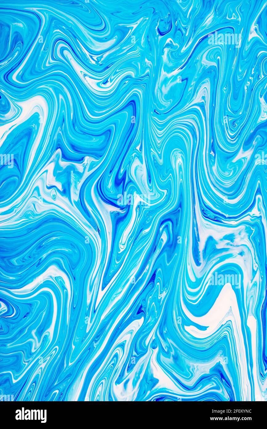 Free flowing blue and white acrylic paint 4. Random Waves and Curls. Abstract marble background or texture. Stock Photo