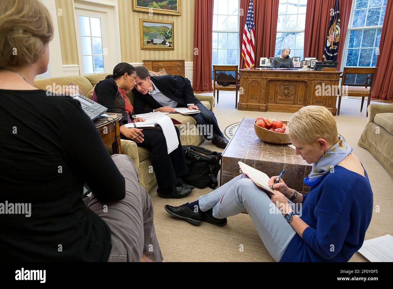 President Barack Obama talks on the phone with Russian President Vladimir  Putin while National Security Advisor Susan E. Rice confers with Tony  Blinken, Deputy National Security Advisor, in the Oval Office, Sunday,