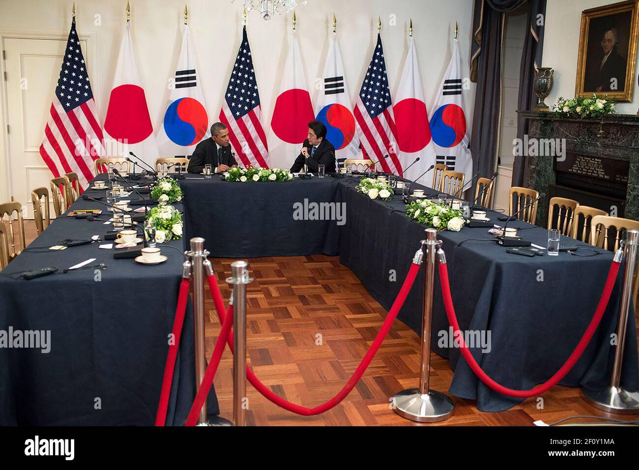 President Barack Obama talks with Prime Minister Shinzo Abe of Japan at the U.S. Ambassador's residence in The Hague, the Netherlands, March 25, 2014 Stock Photo