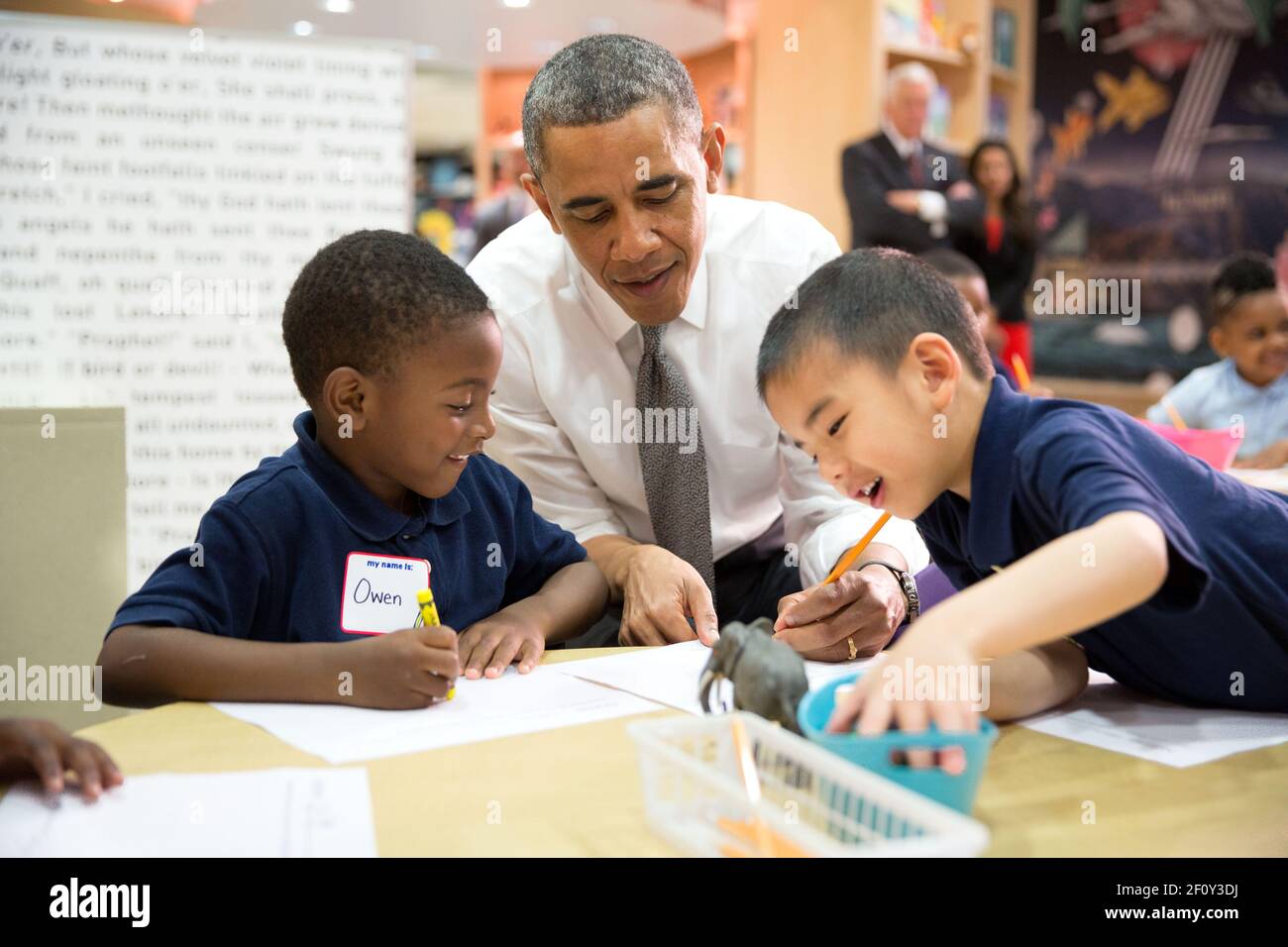 President Barack Obama participates in a literacy lesson with students while visiting a pre-kindergarten classroom at Moravia Elementary School in Baltimore, Md., May 17, 2013 Stock Photo