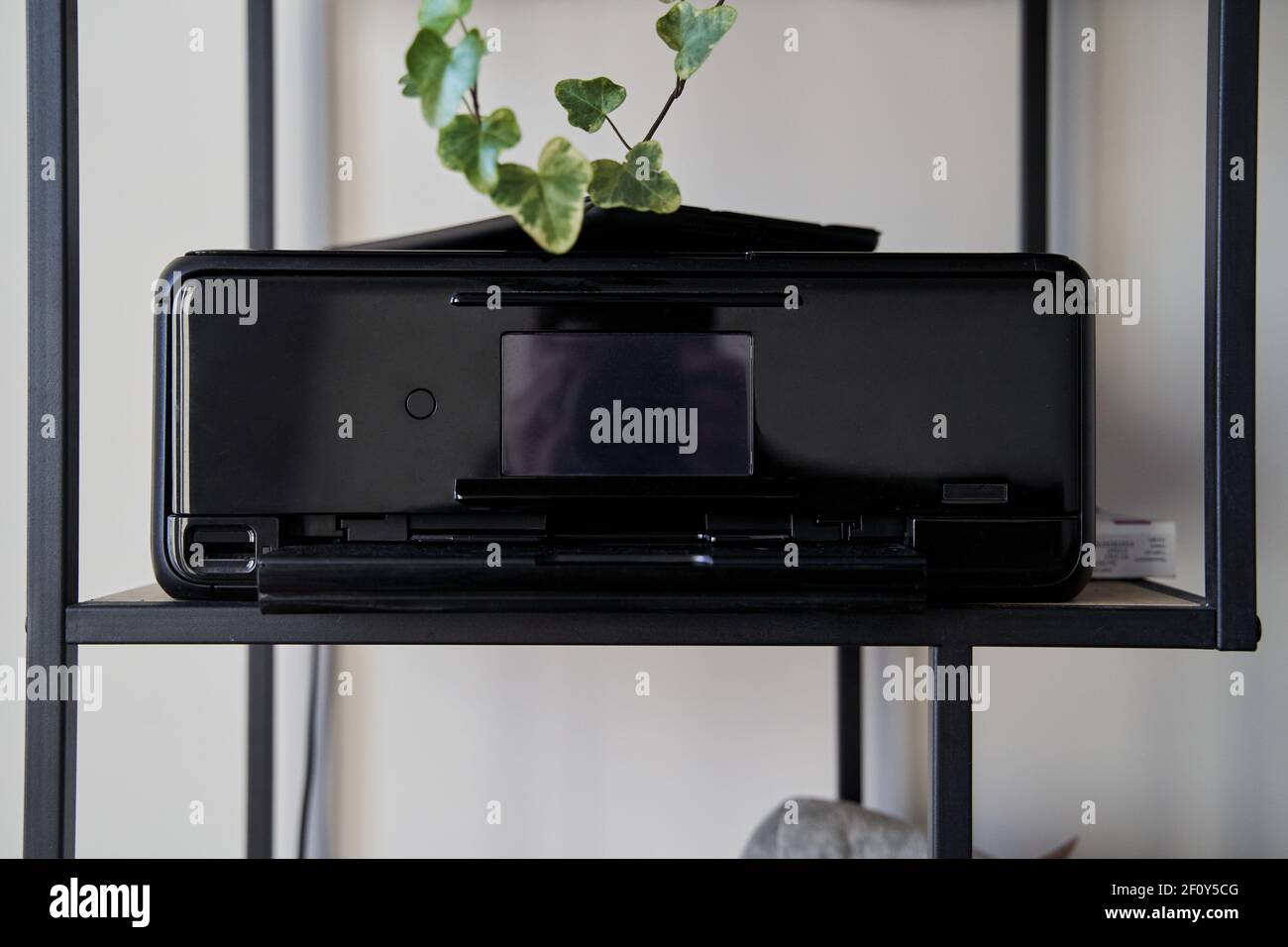 Black inkjet printer is on the shelf Stock Photo