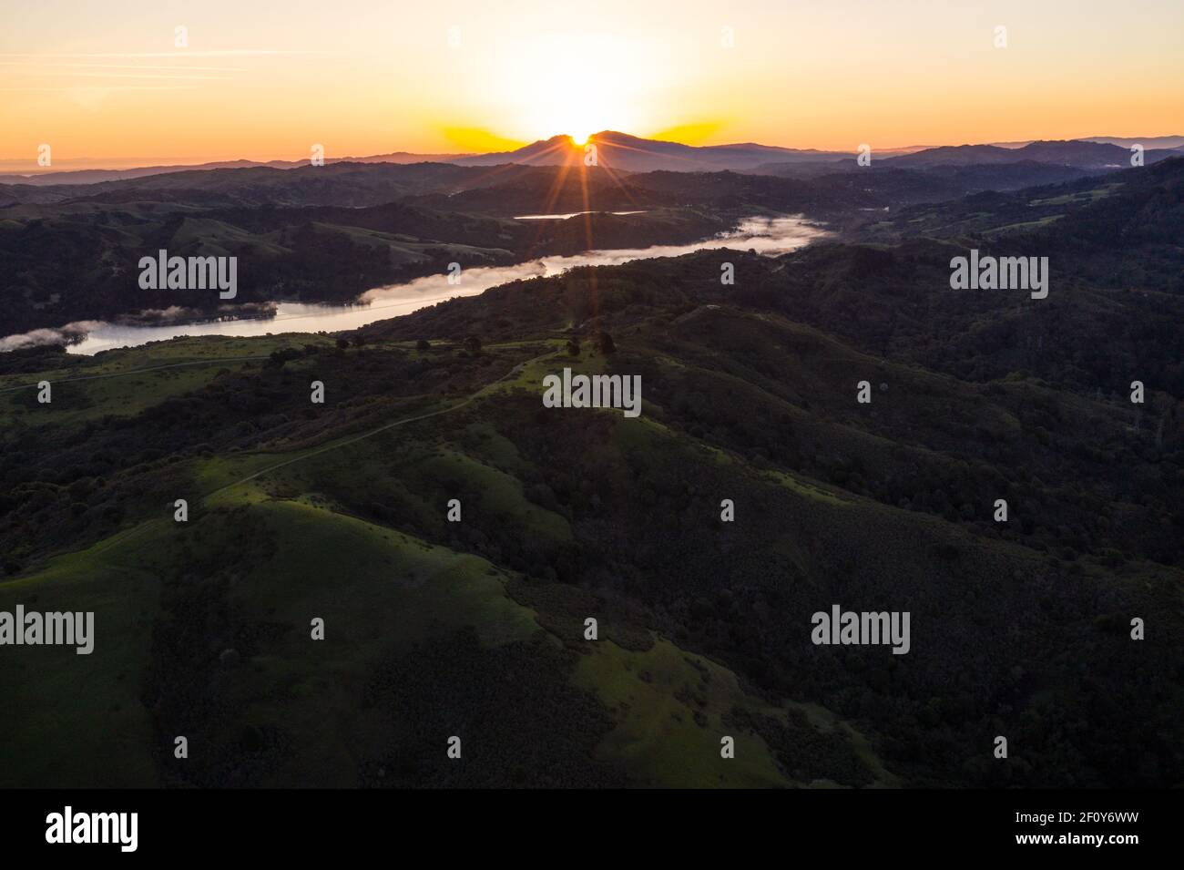 A brilliant sunrise greets the hills of the East Bay, not far from San Francisco Bay in California. Stock Photo
