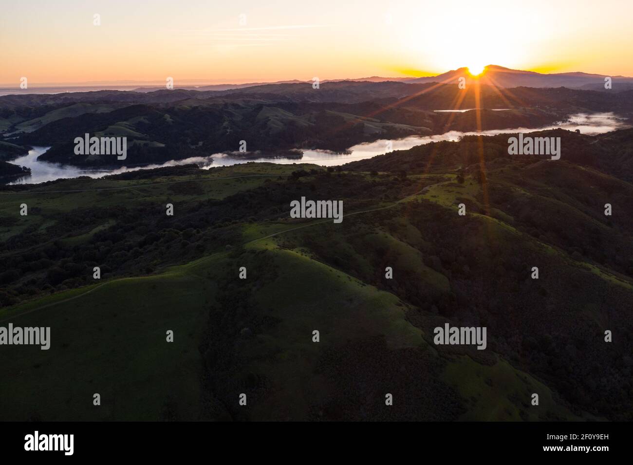 A brilliant sunrise greets the hills of the East Bay, not far from San Francisco Bay in California. Stock Photo