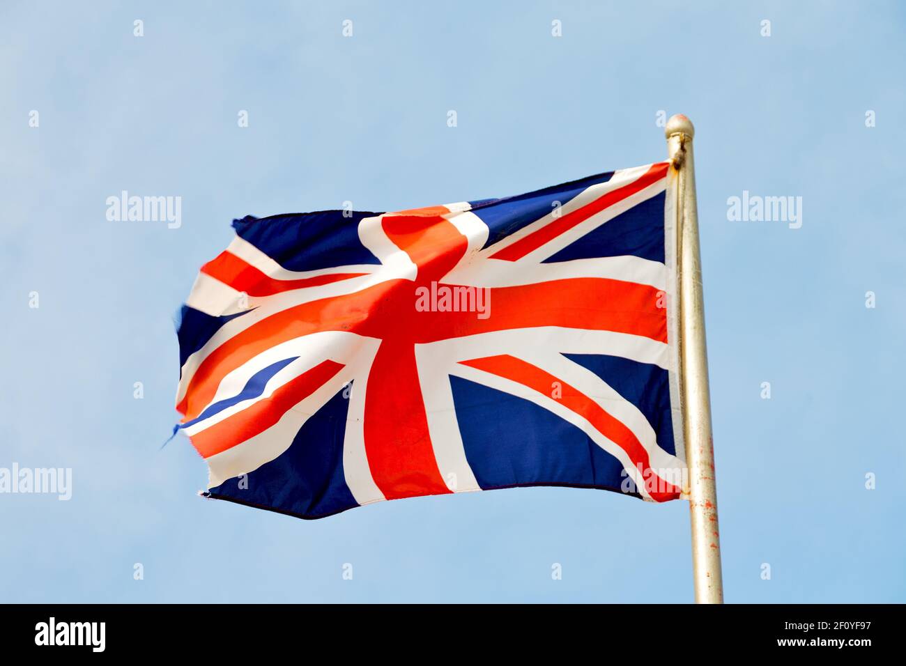 Waving flag in the blue sky british colour and wave Stock Photo
