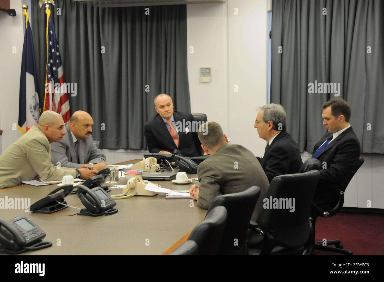 8 December 2008 - New York, NY - New York City Police Commissioner Raymond W. Kelly met today with Lieutenant General Mohammad Munir Mangal, Senior Deputy Minister for Security of the Afghanistan Ministry of the Interior and head of the Afghan National Police. Through an interpreter (far left), Commissioner Kelly and Deputy Minister Mangal discussed optimal methods of policing including counterterrorism, narcotics and anti-corruption with NYPD Deputy Commissioner for Counterterrorism Richard Falkenrath, Deputy Commissioner of Intelligence David Cohen and Colonel Steven M. Lynch of the U.S. Arm Stock Photo