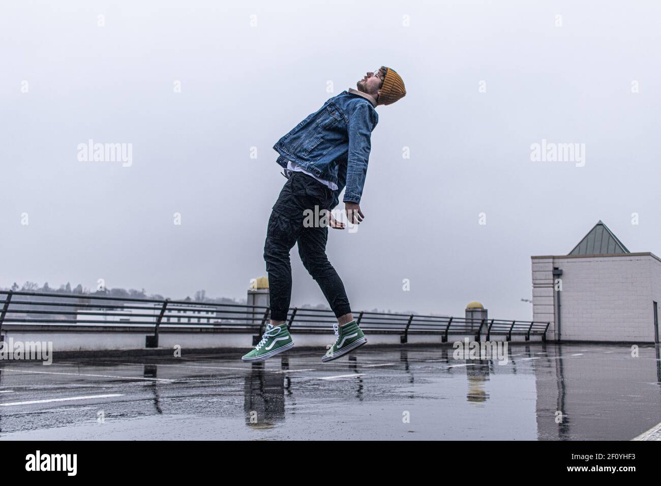 Surrealist Levitation, focusing on free motion and blue colour tones in a modern/urban setting. Stock Photo