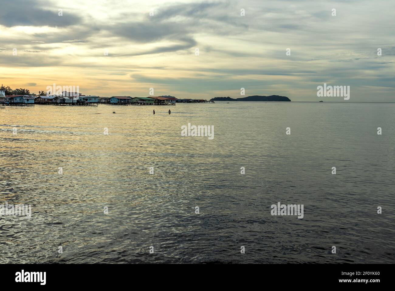 Fishermen at work at Tanjung Aru fishing village Sabah Borneo Malaysia Stock Photo