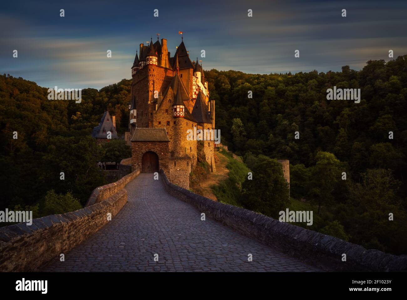 Eltz Castle and stone bridge in sunset light, Germany Stock Photo